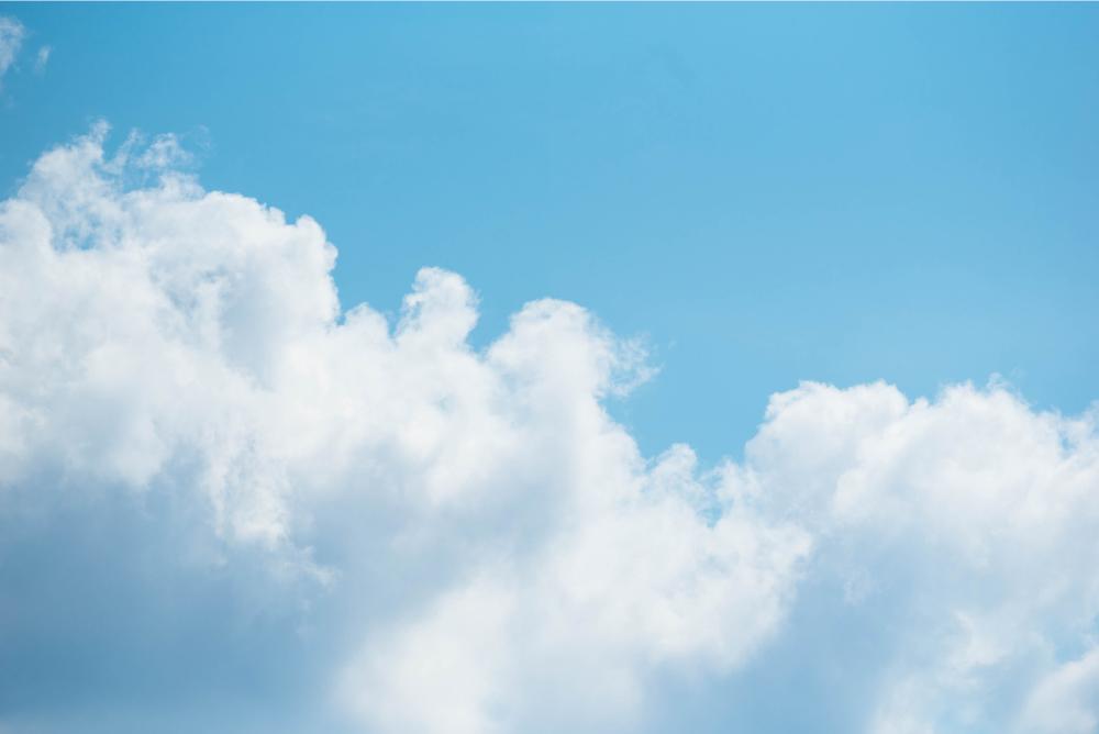 Blue sky with white fluffy clouds