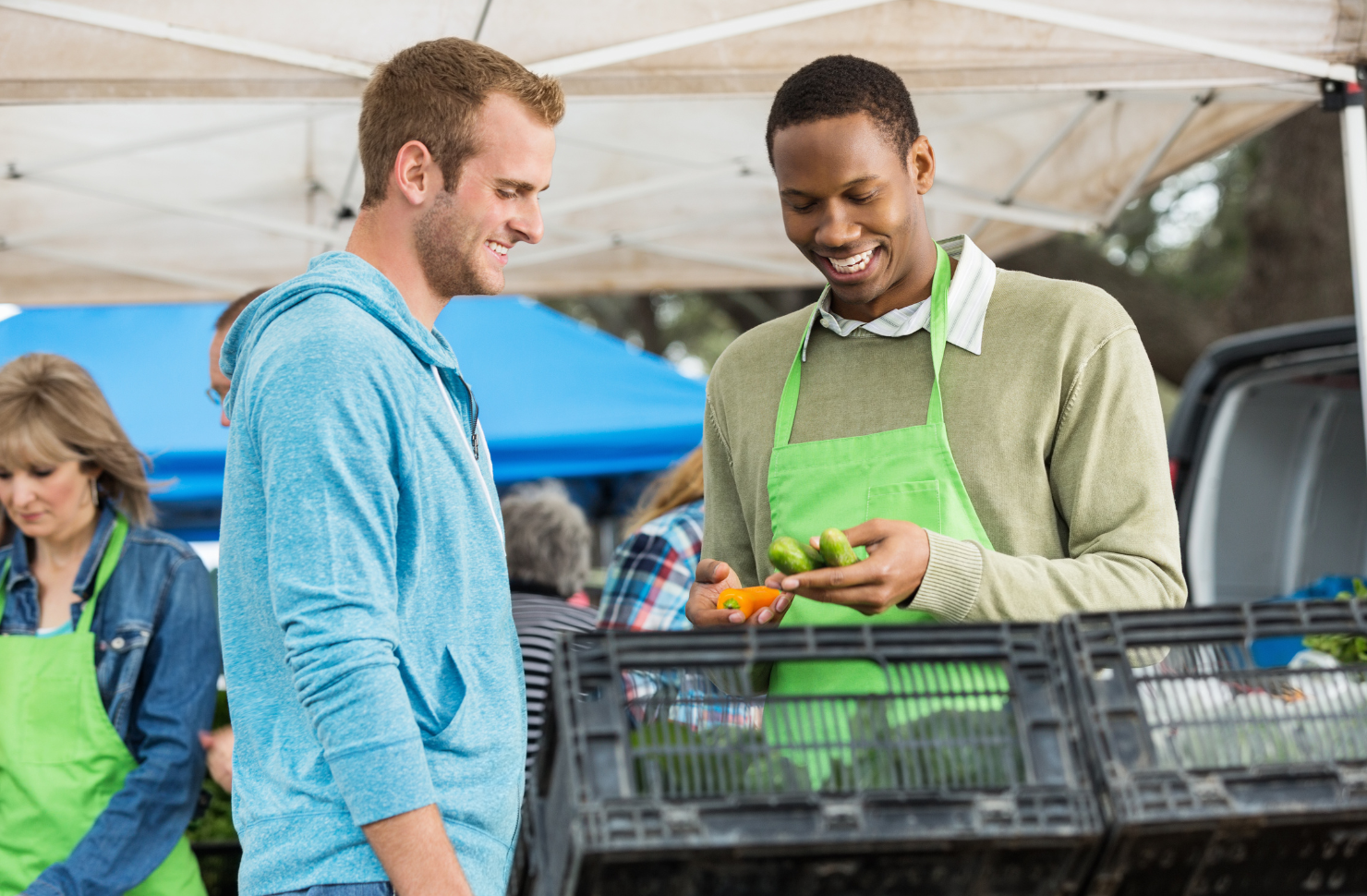 Toggle Outpatient Detox Two People Talking While Shopping at a Farmer's Marketing.