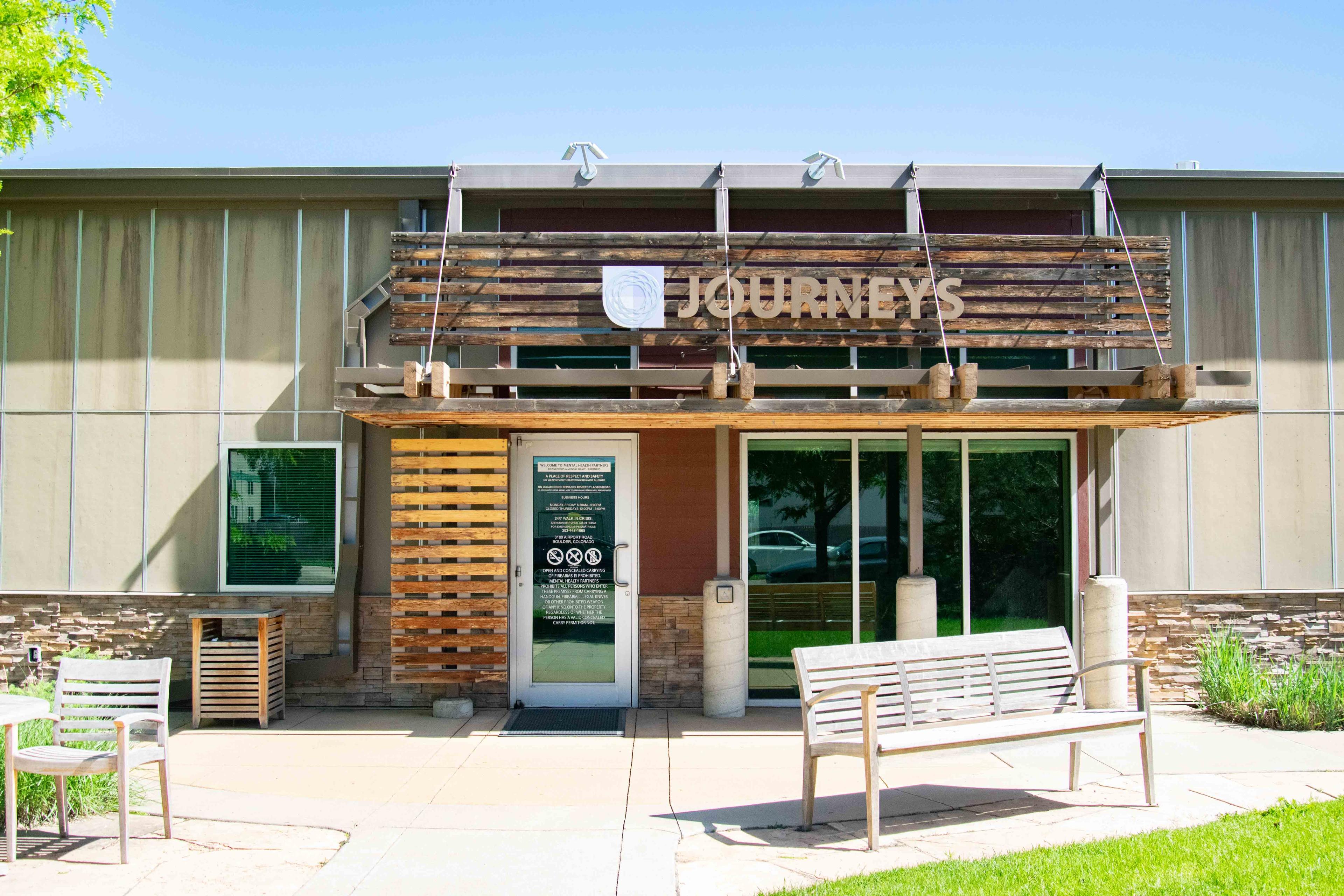 Wellness Center outside. One story building with wooden accents. Sign that reads: Journeys.