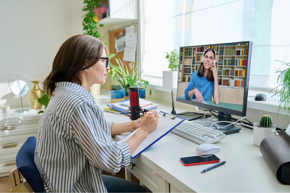 Screening, Brief Intervention, and Referral to Treatment (sbirt) Tile: woman sitting at computer on video call