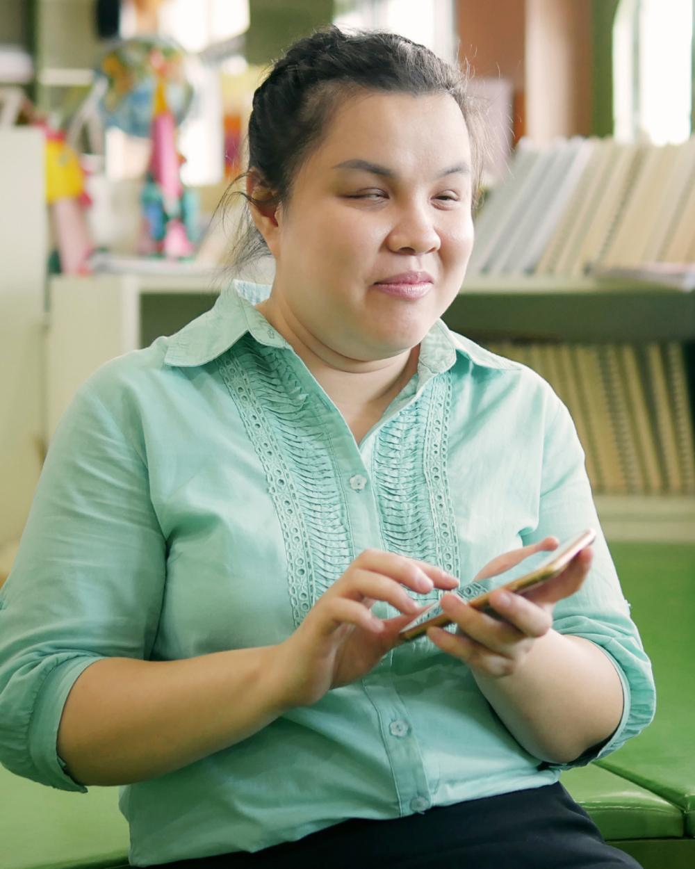 Woman with visual impairment using a smartphone