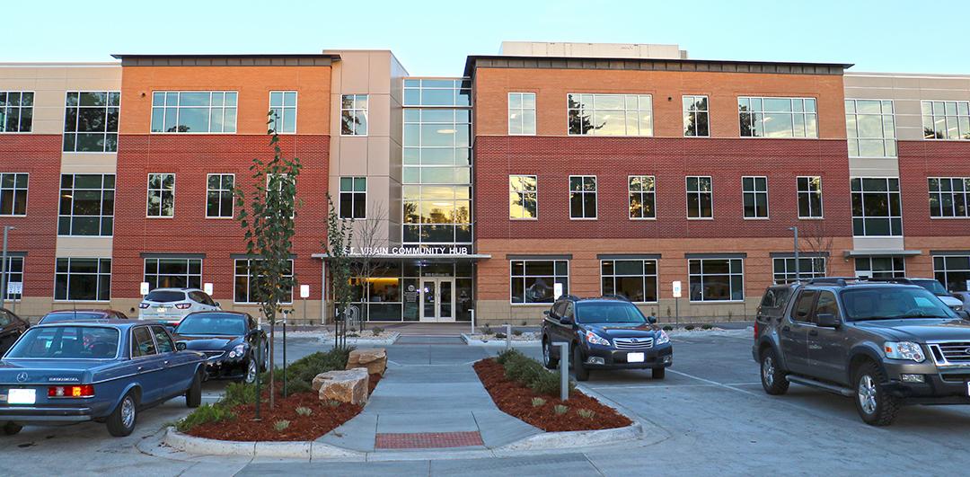 Outside of Coffman building. Three story red and orange brick building with rows of windows.