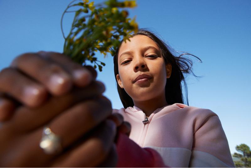 Young girl holding flowers