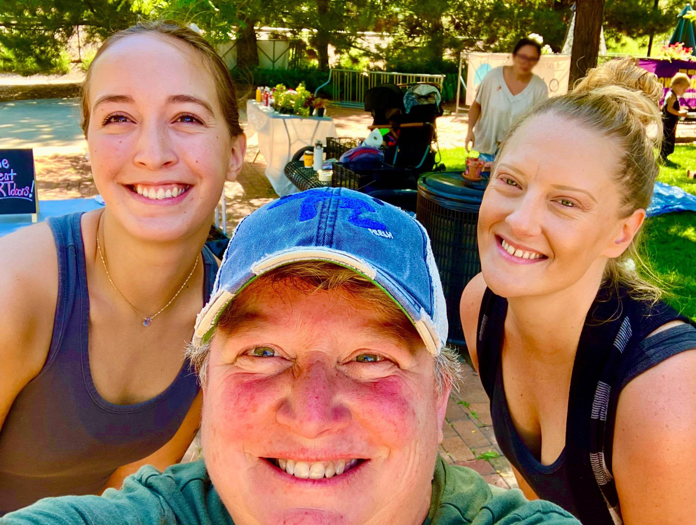 A group of three people taking a selfie