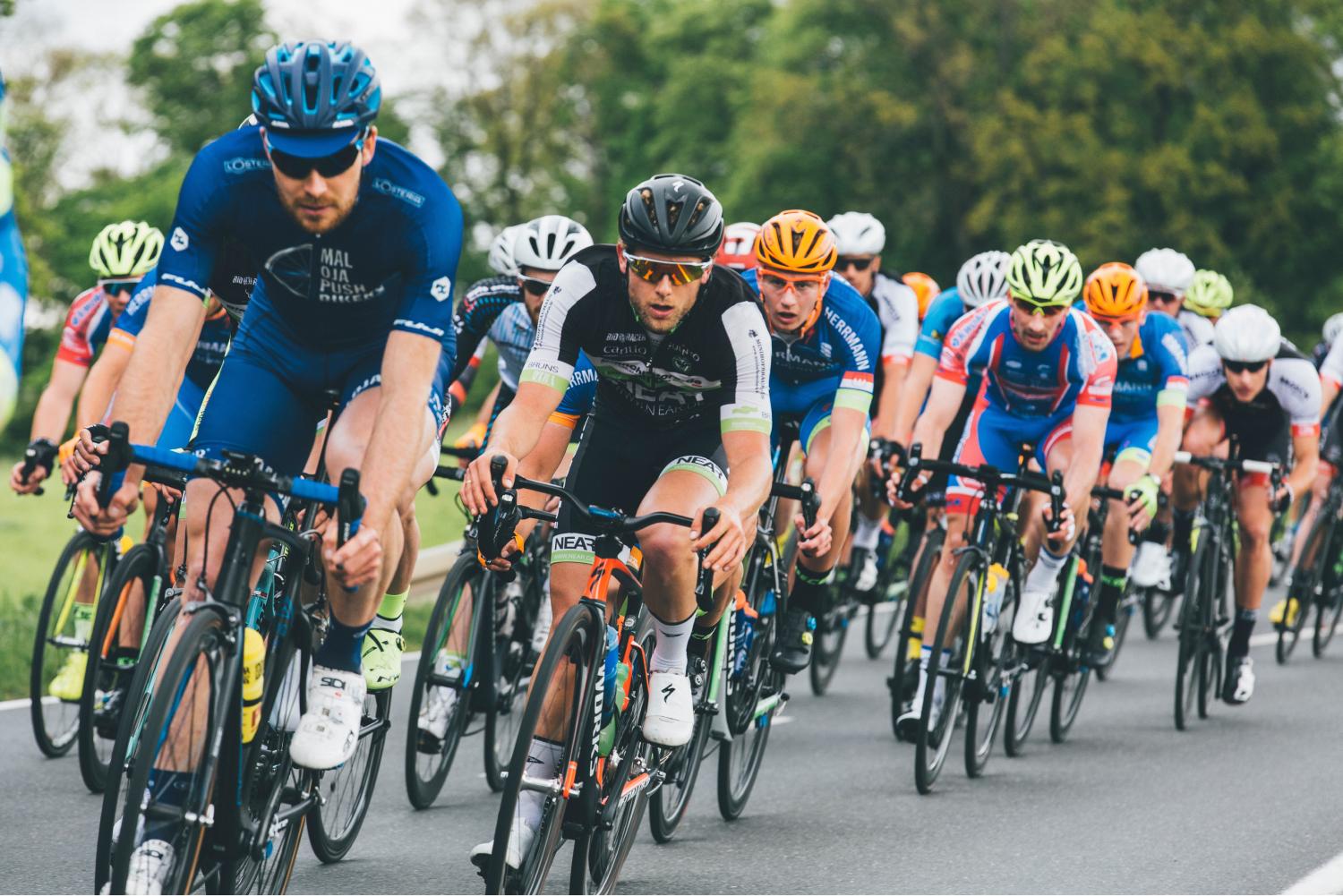 Cyclists riding their bikes.