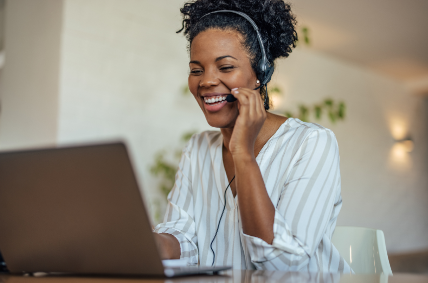 Coordination Person on the Phone With Their Laptop