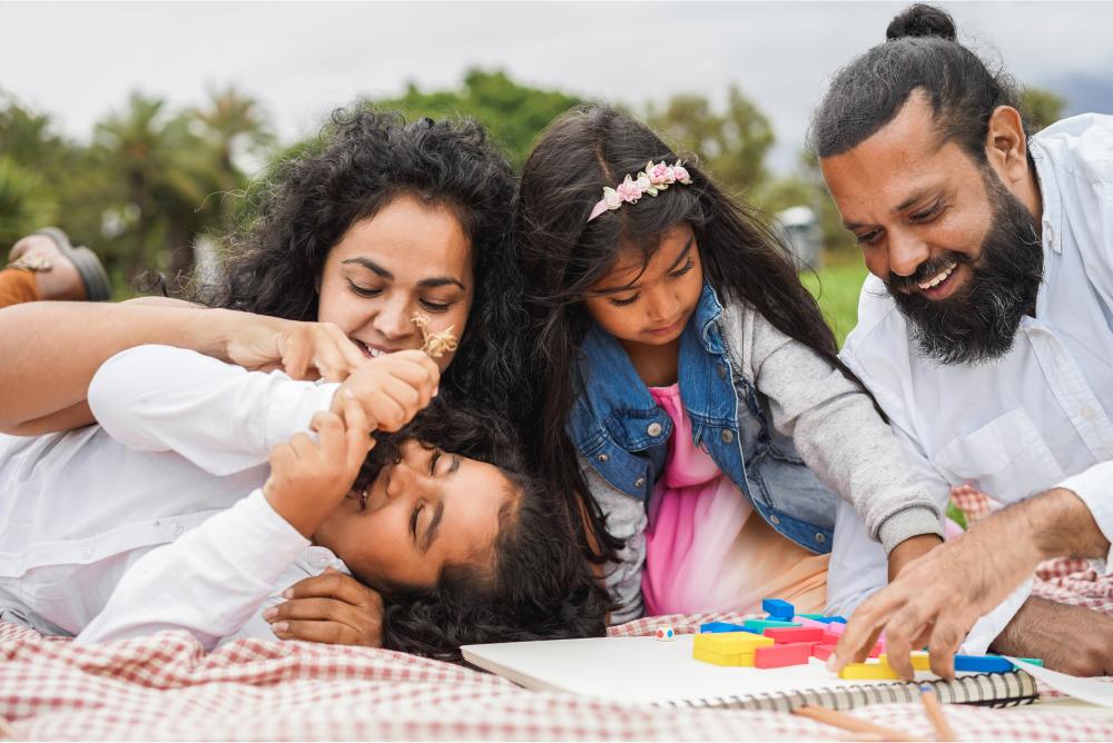 Family playing a game at a picnic