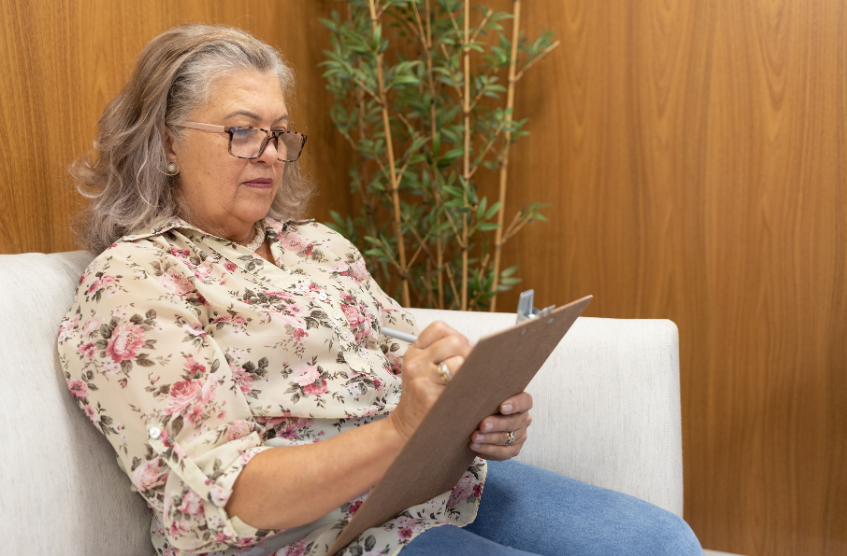 Toggle Evaluations  Woman Filling out Form.