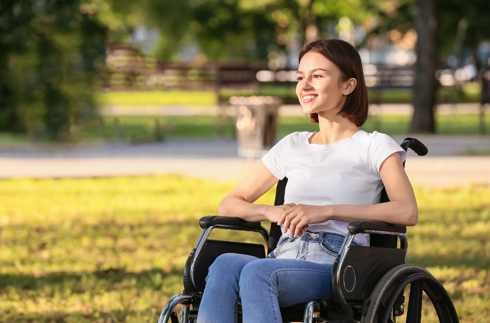 Woman in wheelchair at park.