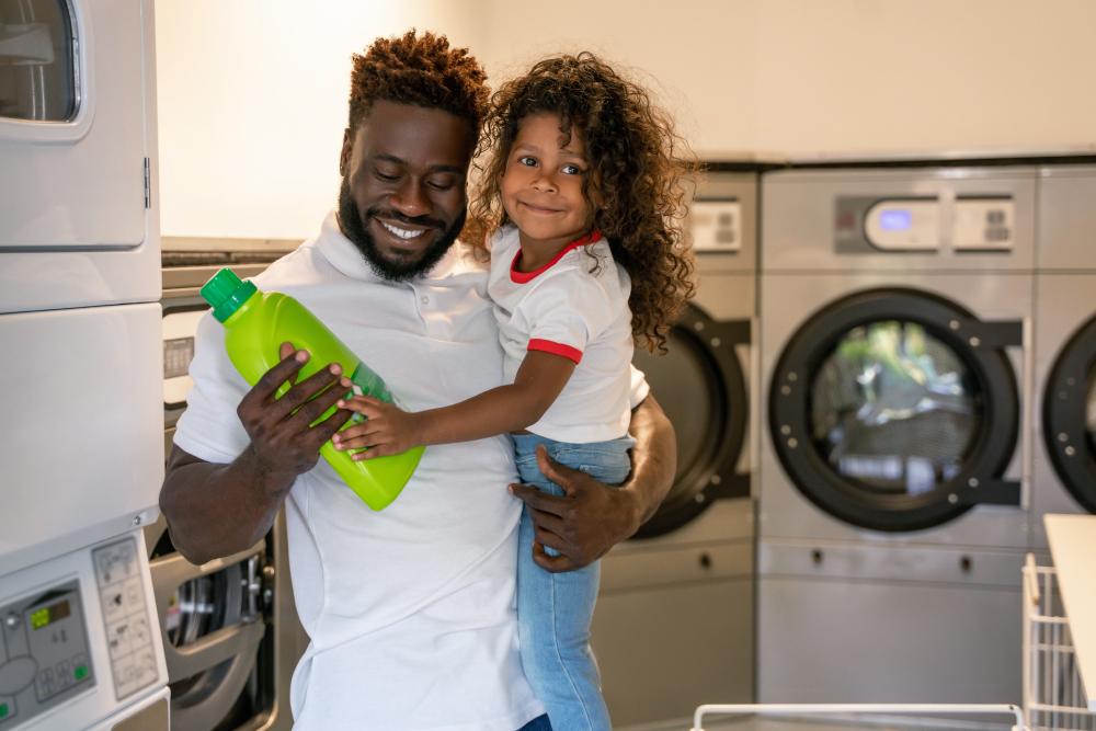 Dad and child in a laundry mat